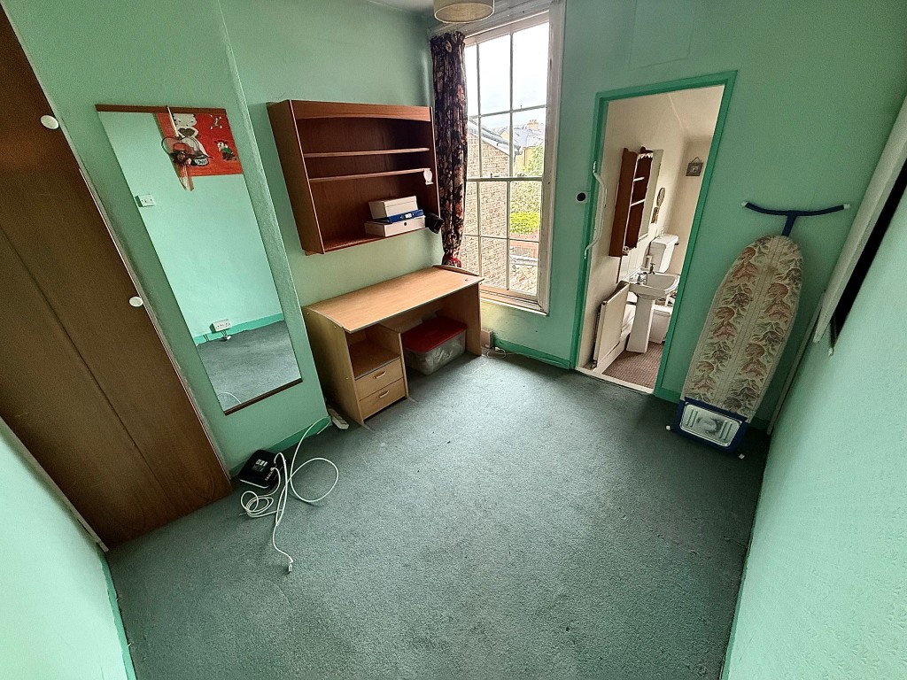 Lot: 76 - TWO-BEDROOM MID-TERRACE HOUSE FOR IMPROVEMENT - Bedroom to rear of property with access to bathroom
